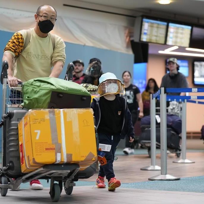 Travellers at YVR feel lucky after flight out of Hong Kong before COVID test rules